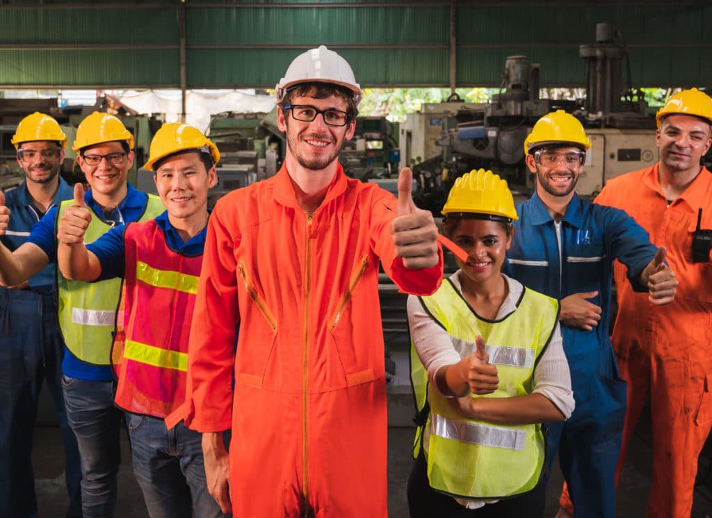 Industrial worker team in a large industrial factory